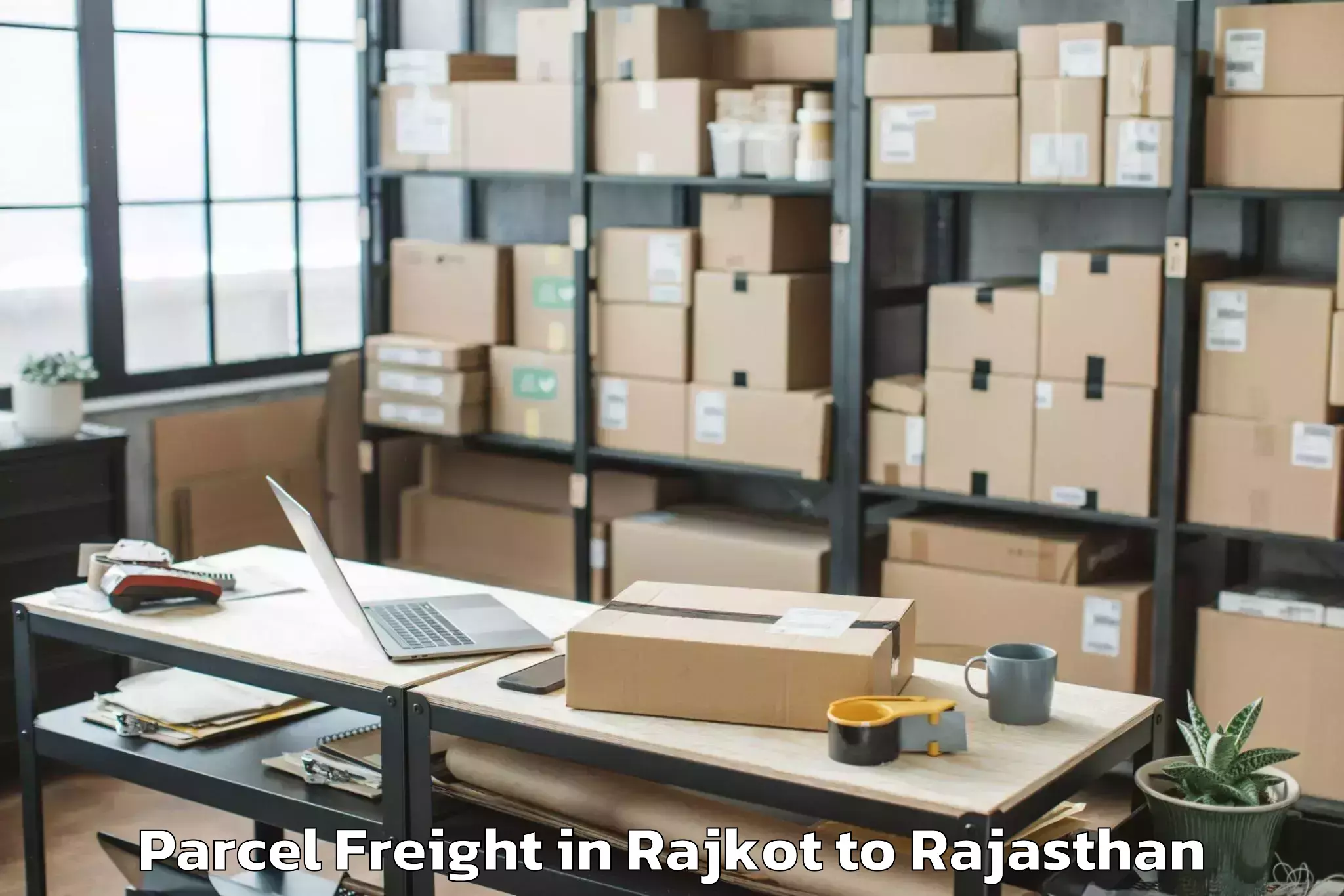 Reliable Rajkot to Opjs University Churu Parcel Freight